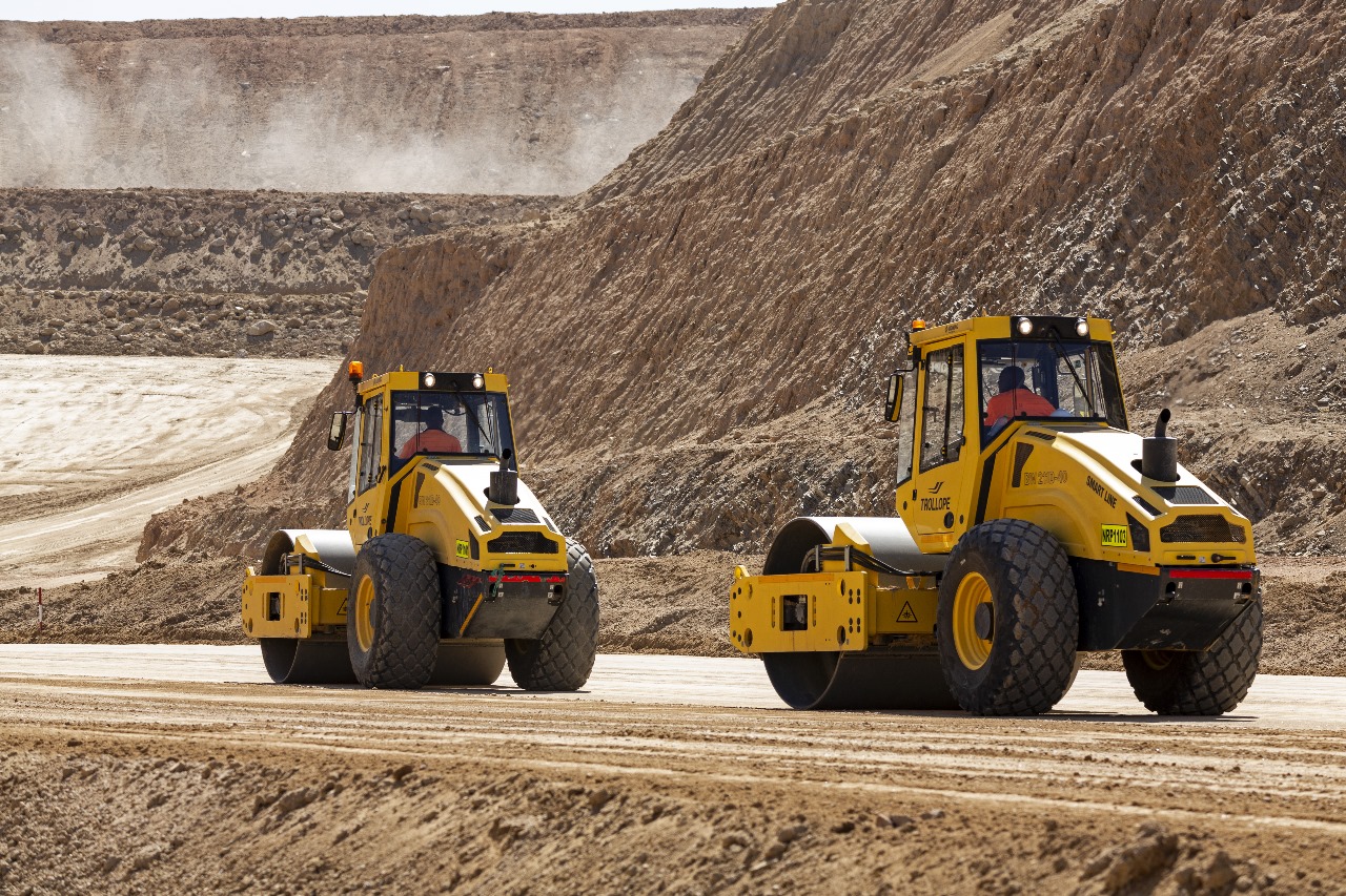 Track-mounted production drill rig positioned on blasted rock
